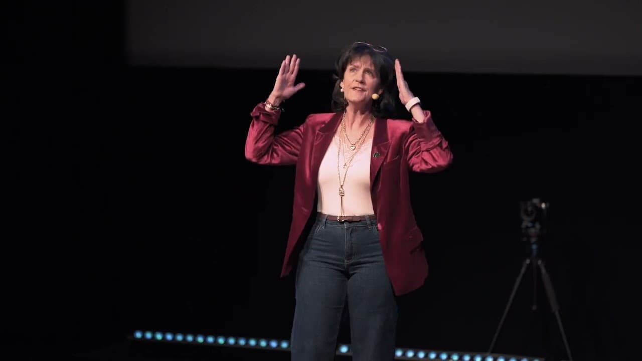 Anne Paphitis speaking on stage at the SpeakerX finale in Sweden